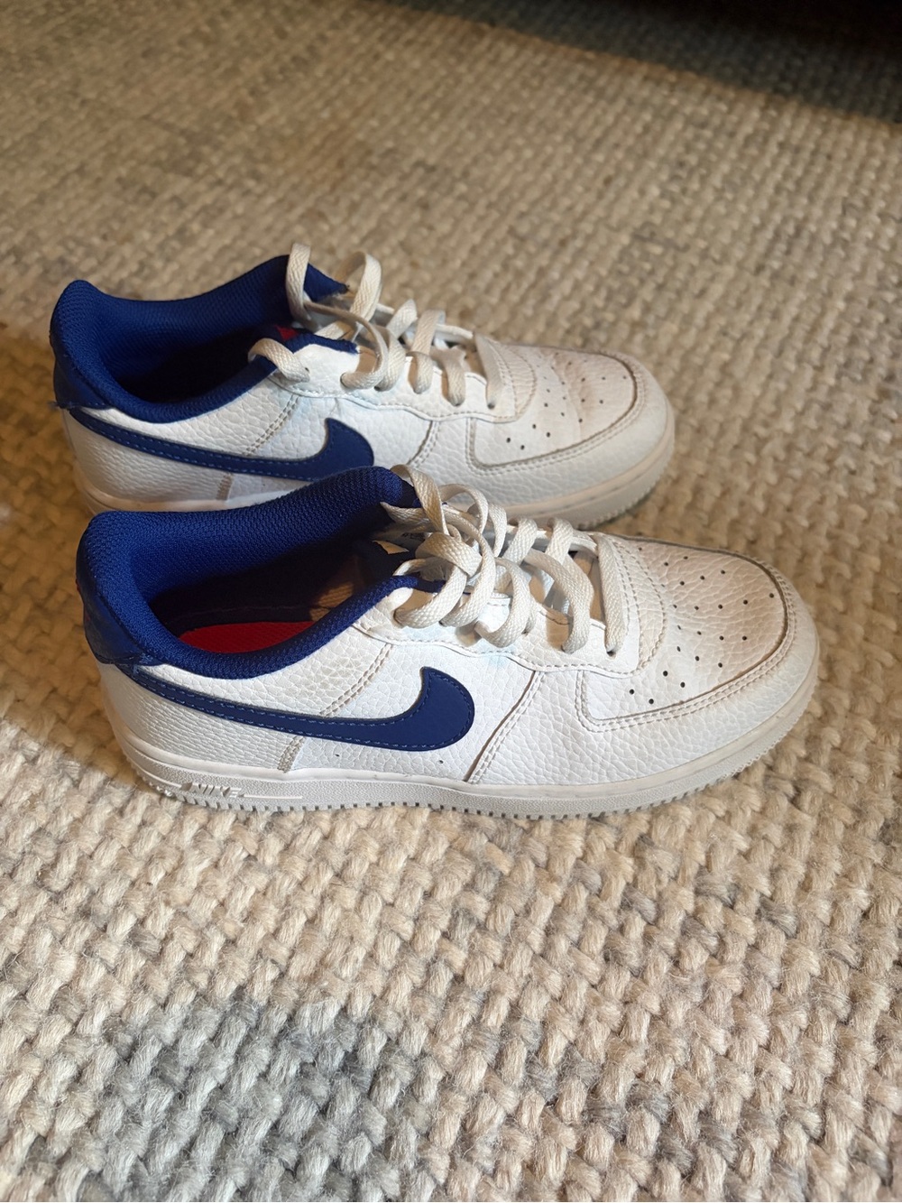 Nike Kids Air Force 1s White Sneakers with Blue Swoosh and Liner